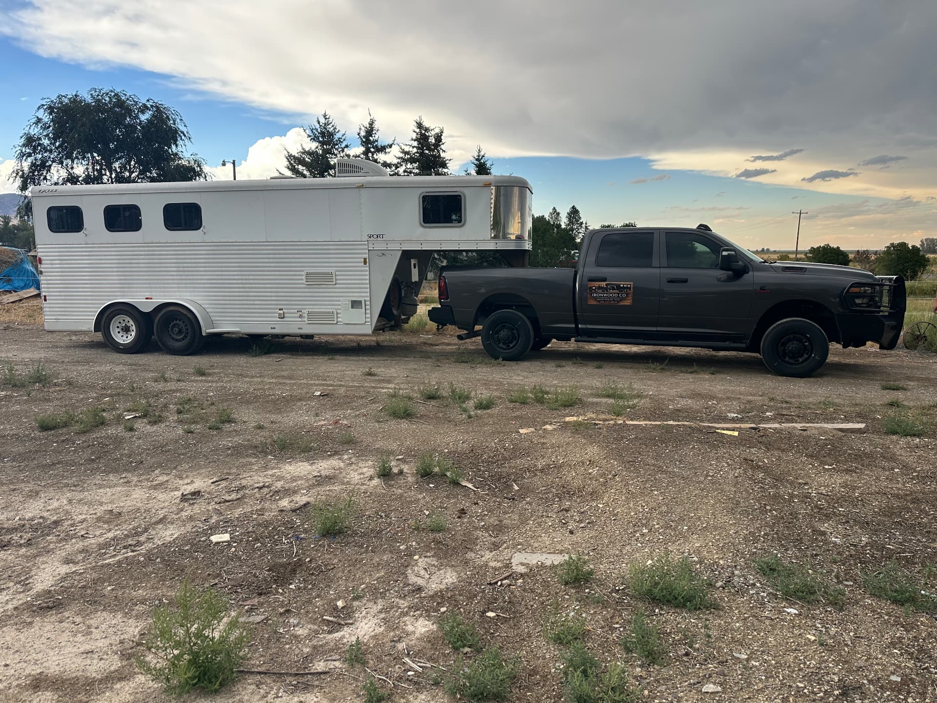 Ironwood Co pickup truck hitched to a white gooseneck horse trailer